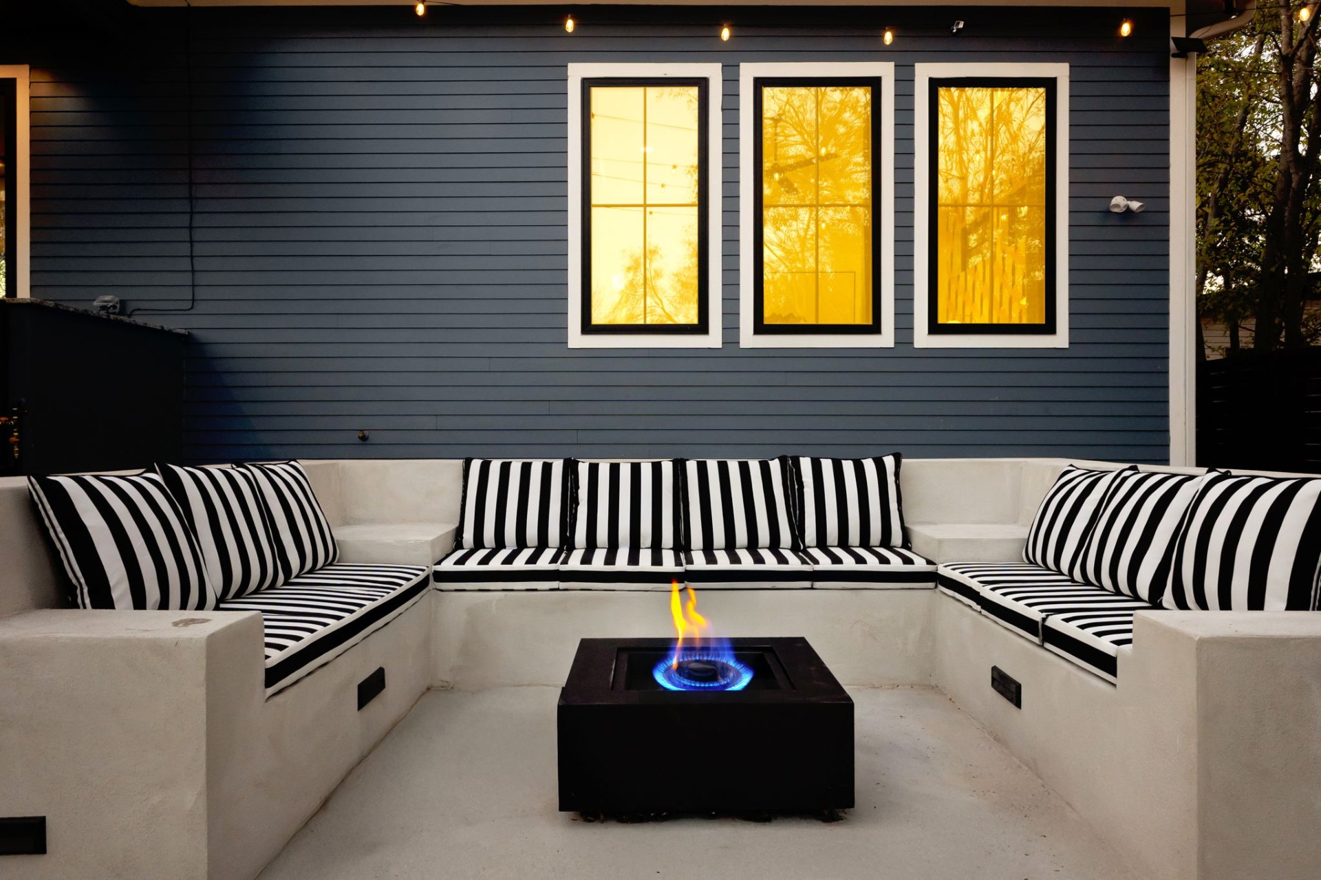 Outdoor firepit lounge with striped seating