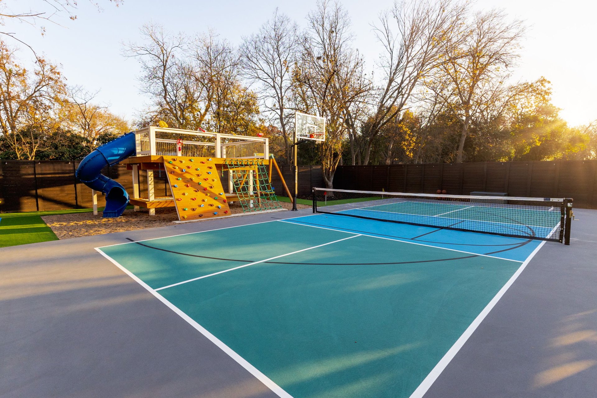 Pickleball and basketball court with playground