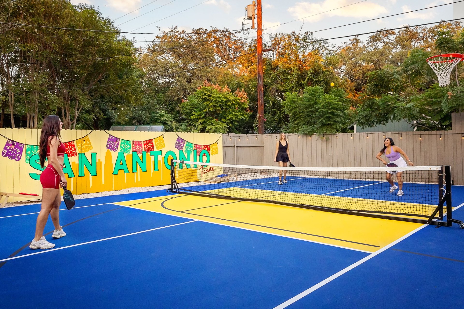 San Antonio backyard pickleball court with mural